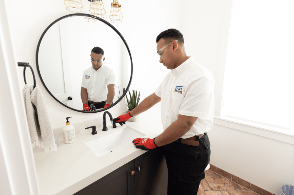 plumber at sink